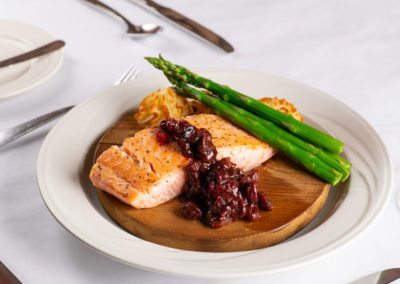 Cedar planked salmon with mashed potatoes, asparagus and cherry relish